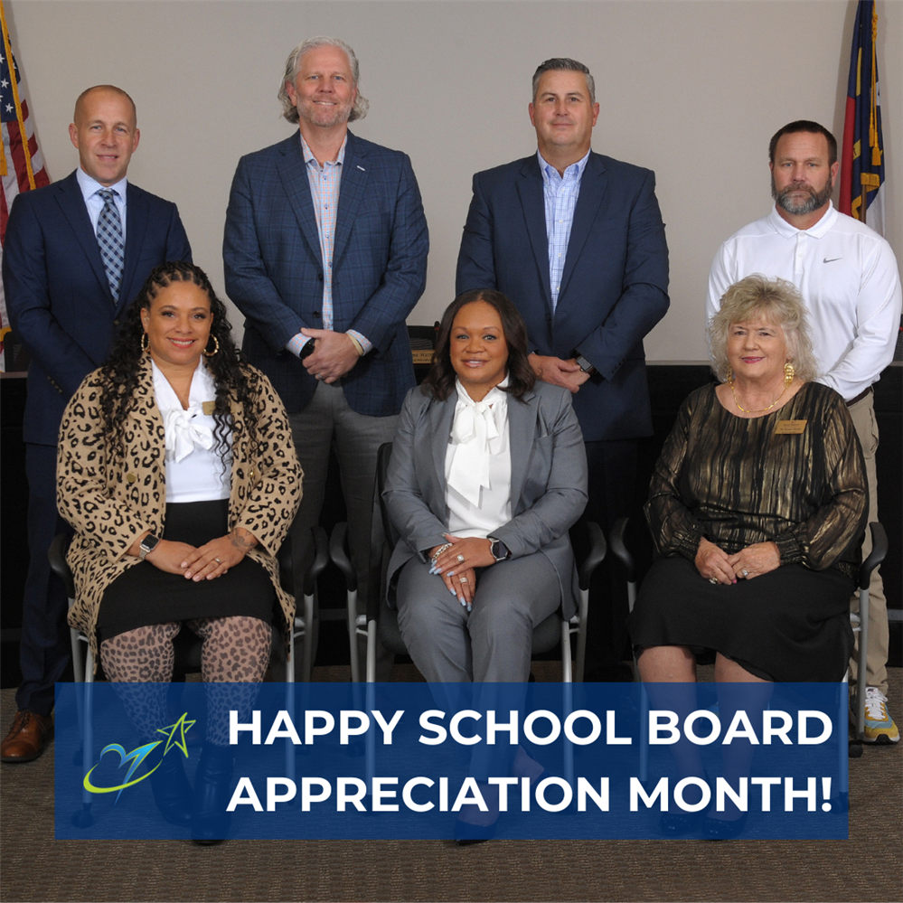  group photo of school board with Happy School Board Appreciation Month on it